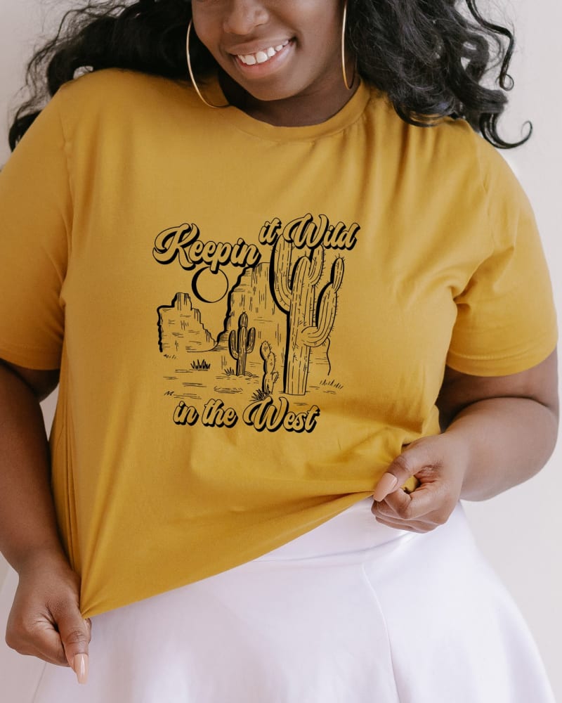 Front of a model wearing a size 2XL Keepin It Wild In The West in Mustard by Simply Sage Market. | dia_product_style_image_id:281679